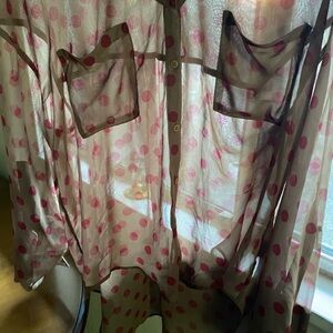 See through polka dot blouse. Shirt in front of long in back. Adjustable